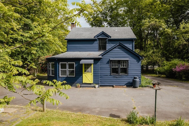2383 State Route 97, Pond Eddy, NY 12770 - view of front of home with a chimney, driveway, and roof with shingles