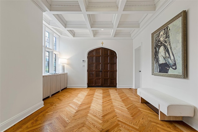 entryway with baseboards, ornamental molding, coffered ceiling, and beamed ceiling