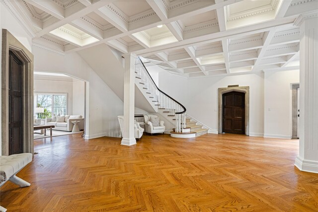 interior space with stairway, baseboards, and beamed ceiling