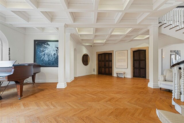entrance foyer with arched walkways, baseboards, beamed ceiling, stairway, and coffered ceiling