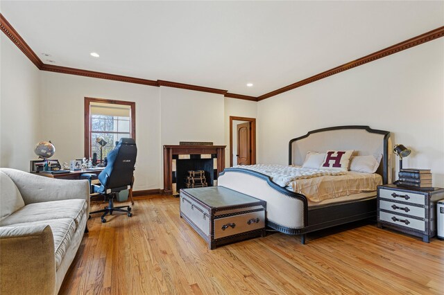 bedroom featuring recessed lighting, baseboards, ornamental molding, and light wood-type flooring