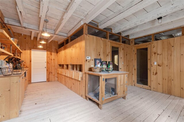 interior space featuring wood walls and hardwood / wood-style floors