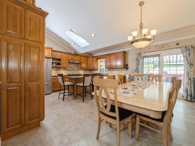 dining space with ornamental molding, a chandelier, recessed lighting, and vaulted ceiling with skylight