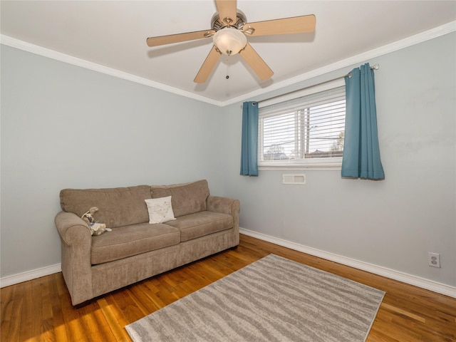 living room with baseboards and wood finished floors