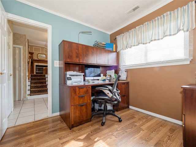 office featuring light wood finished floors, baseboards, and visible vents