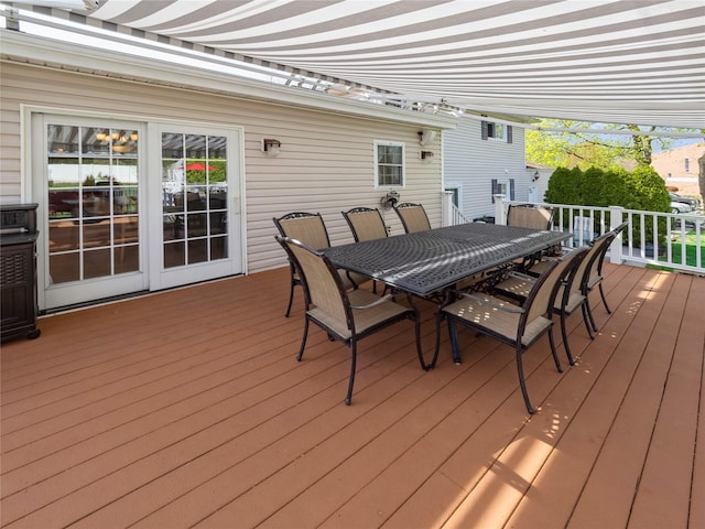 wooden deck with outdoor dining space