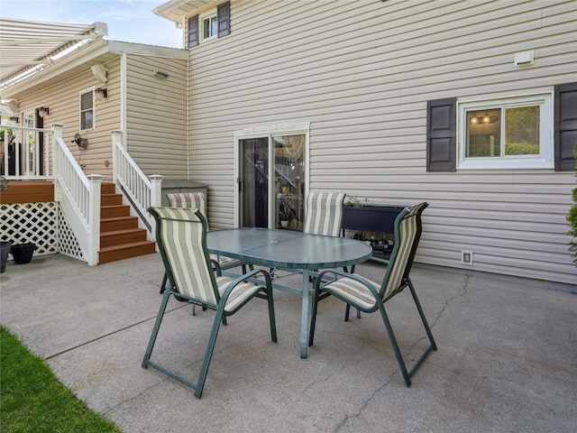 view of patio / terrace with stairway and outdoor dining space