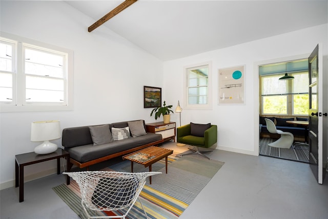 living room with baseboards, finished concrete floors, and vaulted ceiling with beams