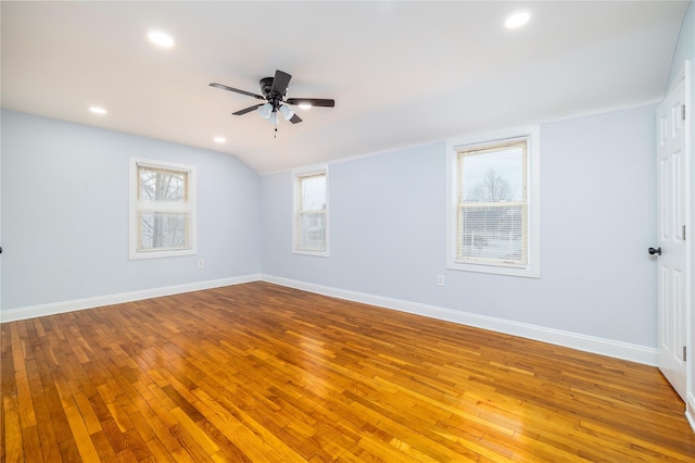 unfurnished room featuring hardwood / wood-style floors, baseboards, and ceiling fan