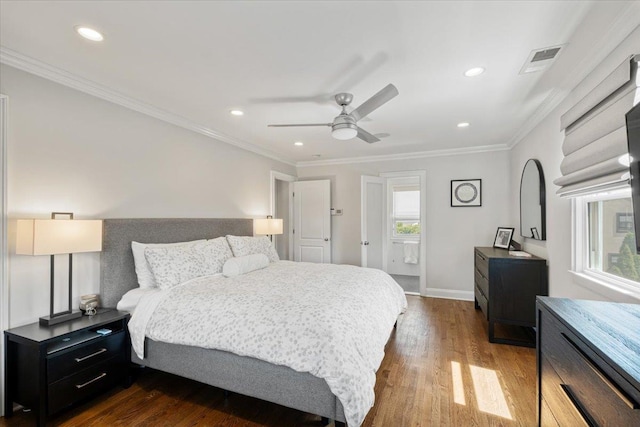 bedroom with dark wood finished floors, visible vents, crown molding, and recessed lighting