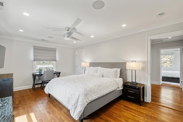 bedroom featuring visible vents, baseboards, recessed lighting, ornamental molding, and wood finished floors