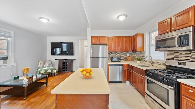 1813 Edenwald Ave, Bronx, NY 10466 - kitchen featuring light countertops, decorative backsplash, stainless steel appliances, and a sink