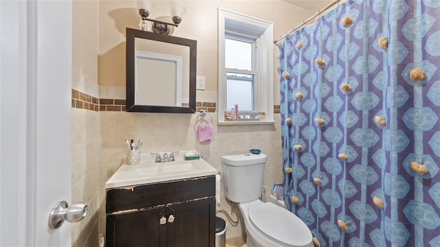 1813 Edenwald Ave, Bronx, NY 10466 - bathroom with wainscoting, vanity, tile walls, a shower with curtain, and toilet