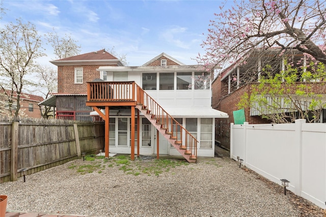 1813 Edenwald Ave, Bronx, NY 10466 - back of property featuring stairway, a fenced backyard, a sunroom, and brick siding