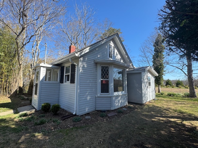 1845 Shipyard Ln, East Marion, NY 11939 - view of side of property featuring a chimney