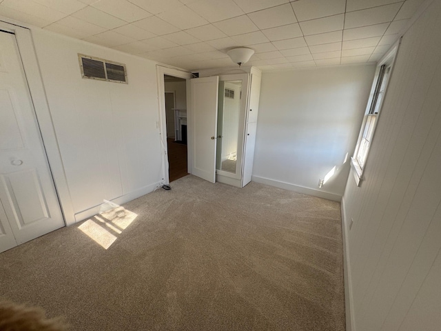 1845 Shipyard Ln, East Marion, NY 11939 - unfurnished bedroom with light colored carpet and baseboards