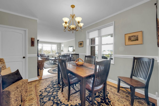 1255 N Ave Unit B-4L, New Rochelle, NY 10804 - dining area with baseboards, ornamental molding, wood finished floors, and a chandelier