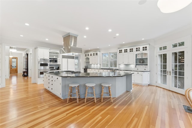 127 Senix Ave, Center Moriches, NY 11934 - kitchen featuring french doors, open shelves, dark countertops, and ornamental molding