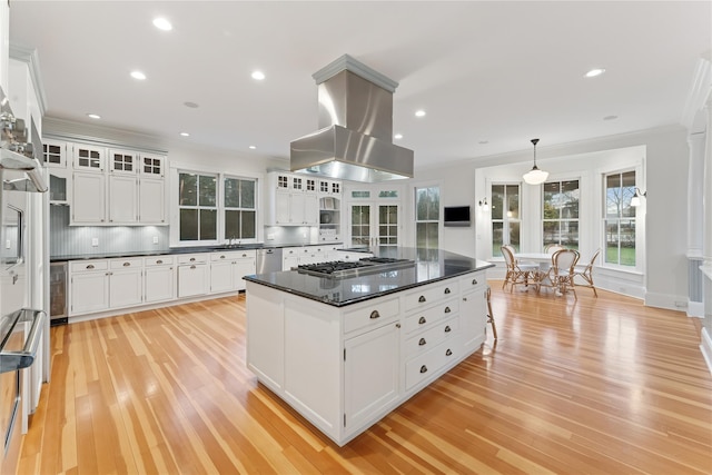 127 Senix Ave, Center Moriches, NY 11934 - kitchen featuring island range hood, dark countertops, light wood finished floors, wine cooler, and stainless steel appliances
