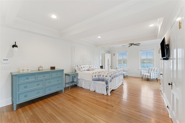 127 Senix Ave, Center Moriches, NY 11934 - bedroom featuring baseboards, ornamental molding, a raised ceiling, and light wood-style floors