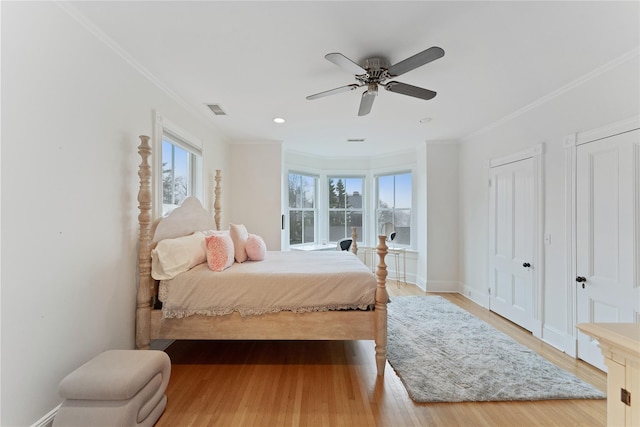 127 Senix Ave, Center Moriches, NY 11934 - bedroom featuring crown molding, ceiling fan, wood finished floors, and visible vents