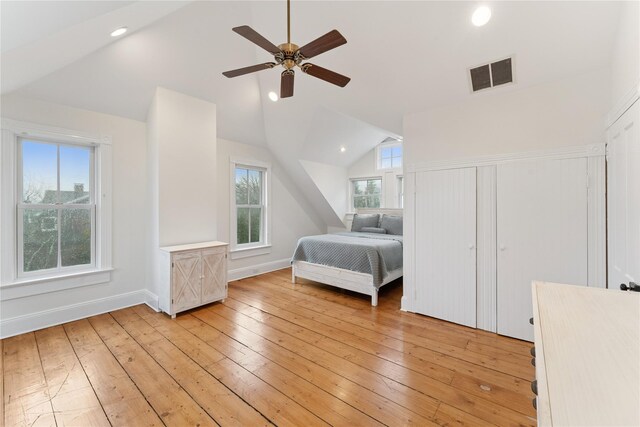 127 Senix Ave, Center Moriches, NY 11934 - bedroom featuring light wood finished floors, recessed lighting, baseboards, lofted ceiling, and visible vents