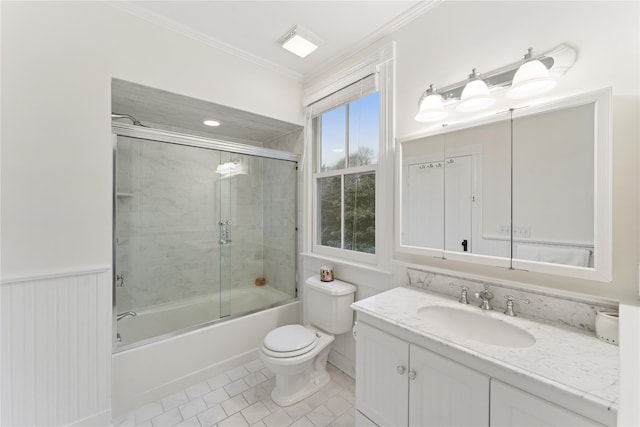 127 Senix Ave, Center Moriches, NY 11934 - full bath featuring crown molding, vanity, toilet, tile patterned floors, and combined bath / shower with glass door