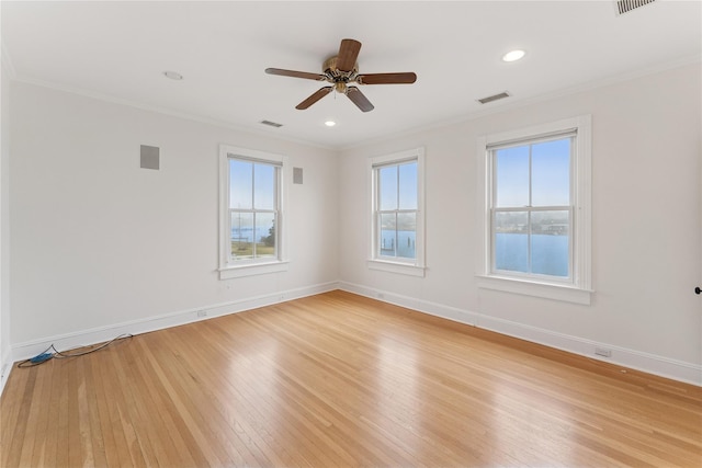 127 Senix Ave, Center Moriches, NY 11934 - unfurnished room featuring visible vents, light wood-style flooring, crown molding, and baseboards
