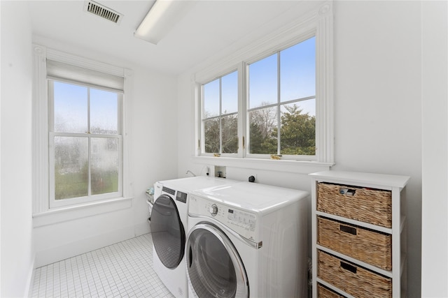 127 Senix Ave, Center Moriches, NY 11934 - laundry room with laundry area, visible vents, tile patterned floors, baseboards, and washer and clothes dryer