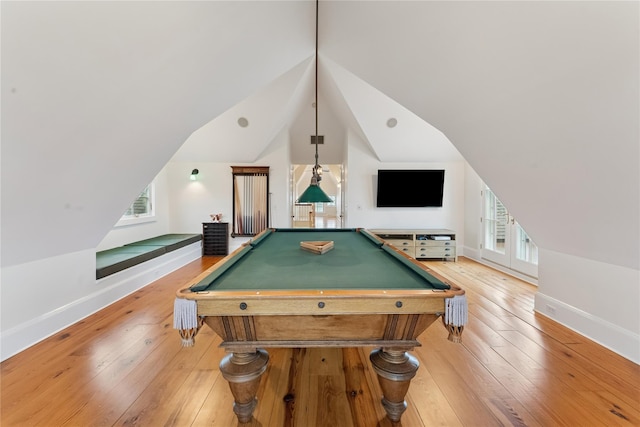 127 Senix Ave, Center Moriches, NY 11934 - playroom with baseboards, billiards, lofted ceiling, and light wood-type flooring