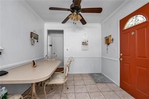 1103 Rhinelander Ave, Bronx, NY 10461 - dining space with ceiling fan, crown molding, and light tile patterned floors