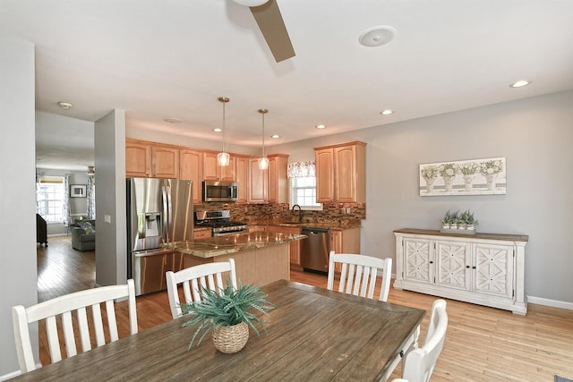 209 Pleasant Dr, Bay Shore, NY 11706 - dining area with baseboards, recessed lighting, and light wood-style flooring