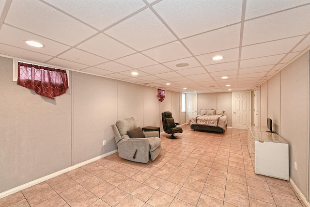 209 Pleasant Dr, Bay Shore, NY 11706 - living area with light tile patterned flooring, a paneled ceiling, and recessed lighting