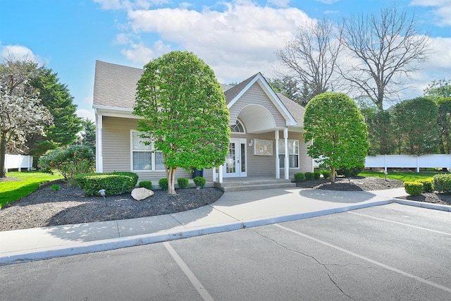209 Pleasant Dr, Bay Shore, NY 11706 - view of building exterior with uncovered parking