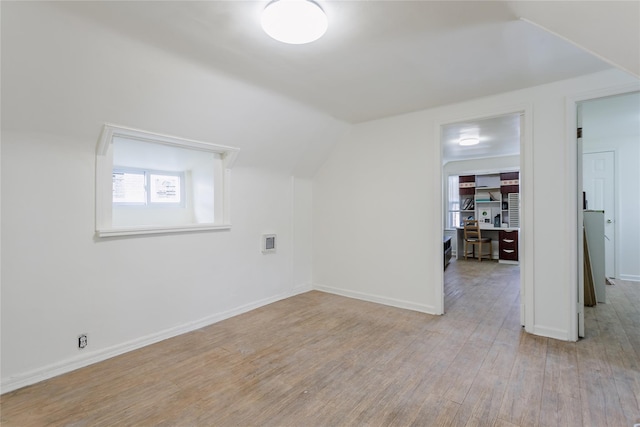 32-12 208th St, Bayside, NY 11361 - bonus room featuring plenty of natural light, lofted ceiling, baseboards, and light wood-style flooring