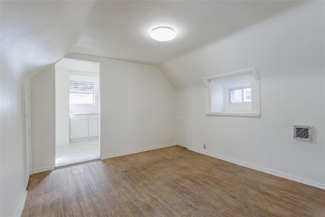 32-12 208th St, Bayside, NY 11361 - bonus room featuring lofted ceiling, a healthy amount of sunlight, and wood finished floors