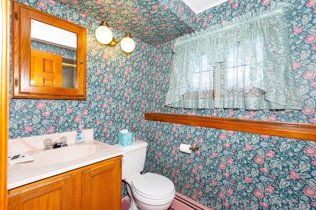 bathroom with wallpapered walls, toilet, and vanity
