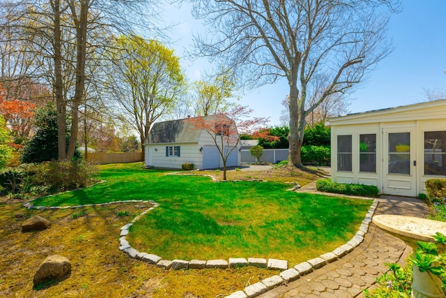 view of yard with an outbuilding and fence