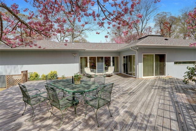 wooden terrace featuring outdoor dining area