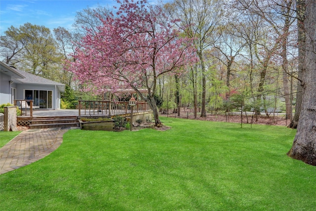 view of yard with a wooden deck