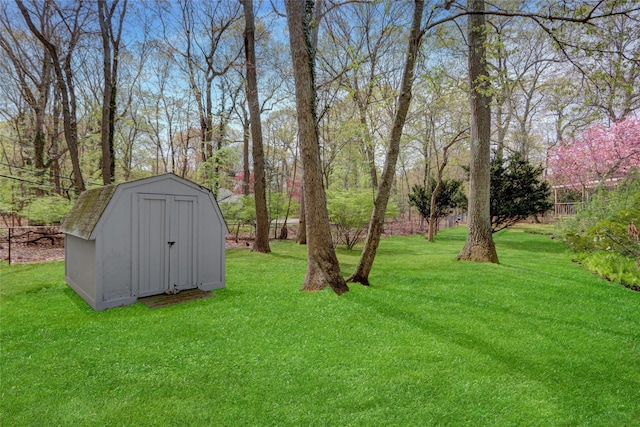 view of yard with an outdoor structure and a shed