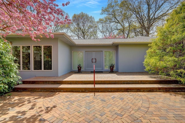 doorway to property featuring a patio area