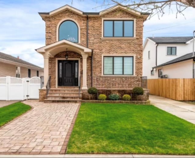 158-40 81st St, Howard Beach, NY 11414 - traditional home featuring a gate, brick siding, a front yard, and fence