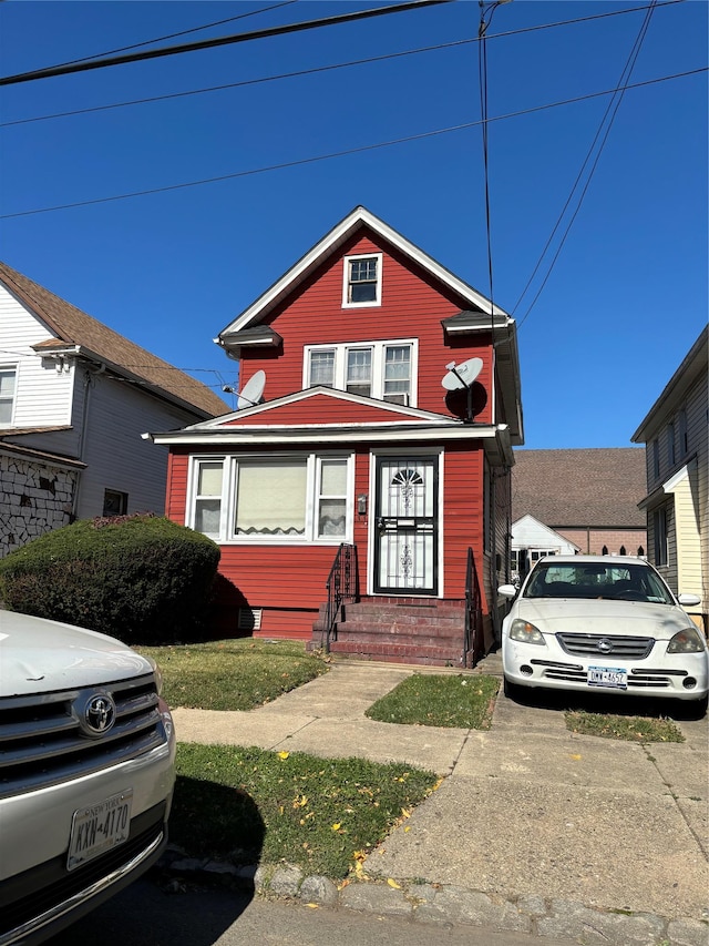 traditional-style home featuring entry steps