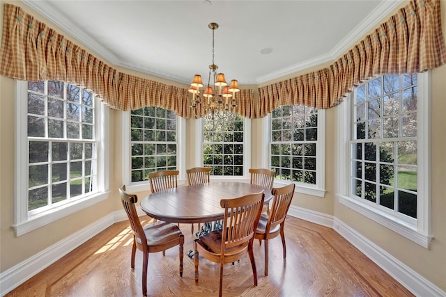85 Woodlands Rd, Harrison, NY 10528 - dining room with baseboards, a chandelier, wood finished floors, and ornamental molding