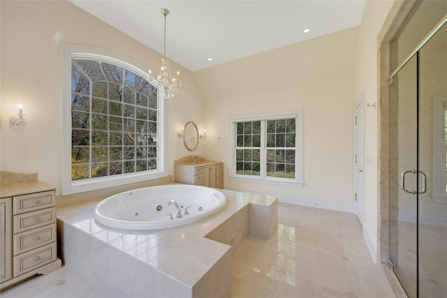 85 Woodlands Rd, Harrison, NY 10528 - full bath with vanity, a stall shower, a jetted tub, and tile patterned floors