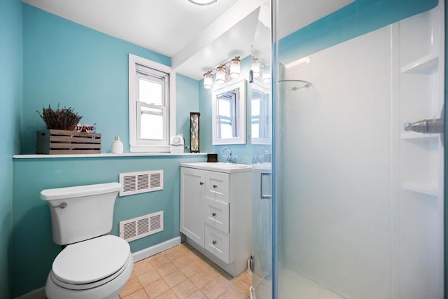 full bath with vanity, tile patterned floors, toilet, a stall shower, and visible vents