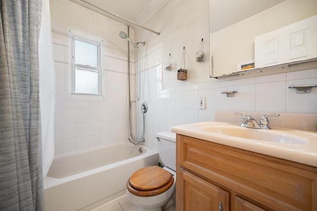 full bathroom with tile walls, shower / bathtub combination with curtain, toilet, and vanity