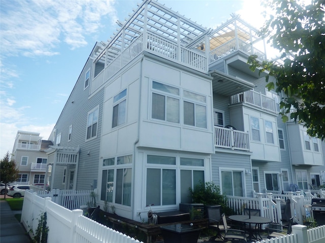 view of building exterior featuring fence