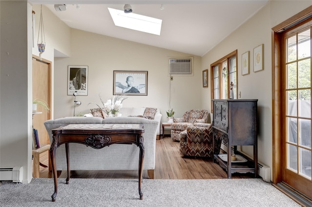 living area featuring a wall mounted AC, lofted ceiling with skylight, baseboard heating, and wood finished floors